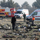 Rescue teams work amidst debris after a Ukrainian plane carrying 176 passengers crashed near Imam Khomeini airport in the Iranian capital Tehran early in the morning on January 8, 2020